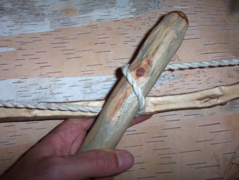 Make sure the spindle is on the opposite side of the string to the bow. Otherwise the spindle will knock against the bow while stroking.